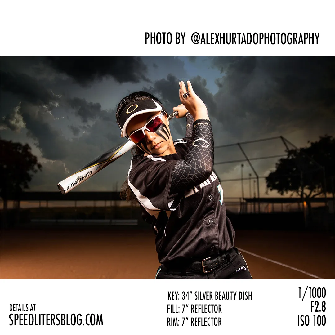 Softball player swinging a bat on a dusk-lit field, three-light sports portrait by Alex Hurtado