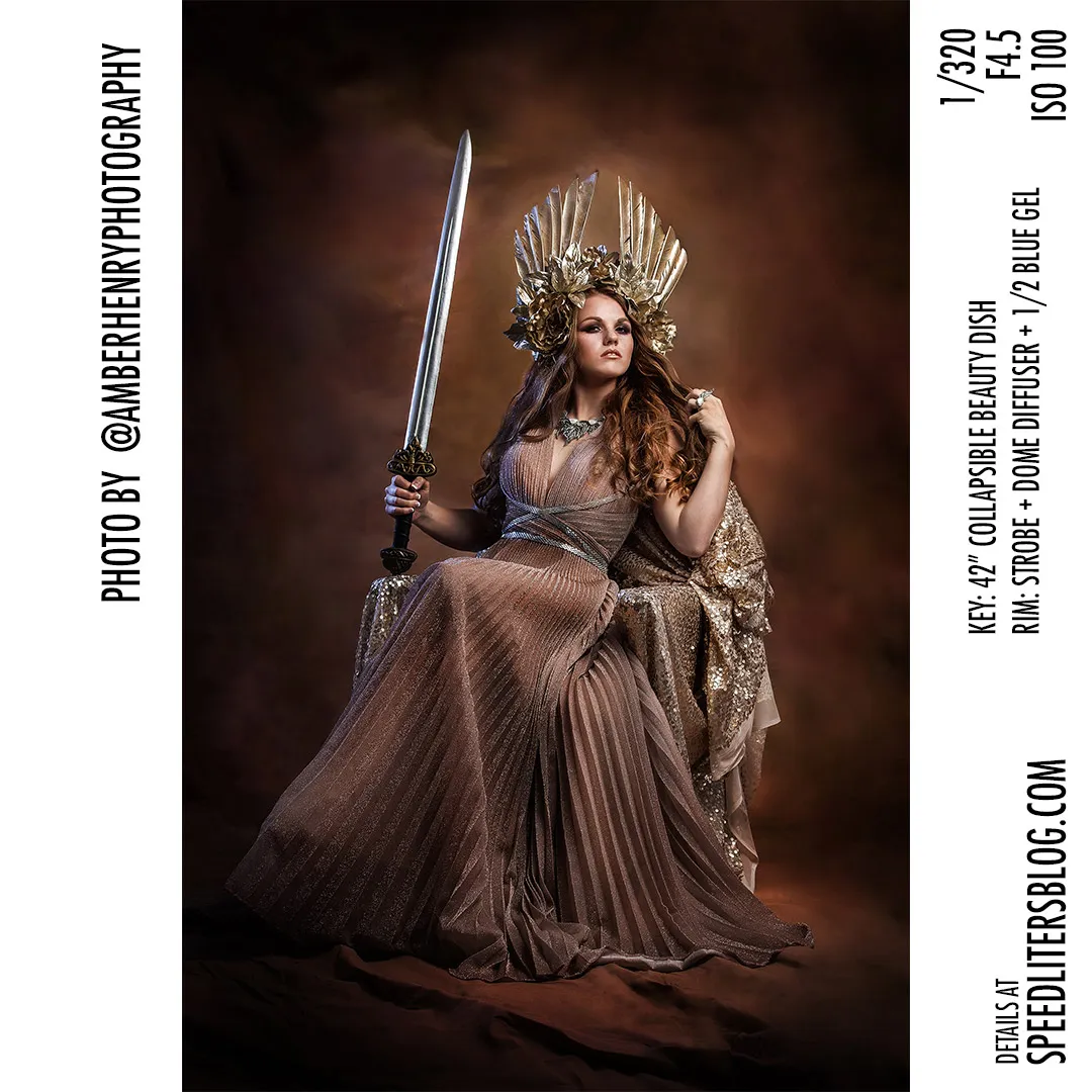 Woman in a golden headdress seated on a throne holding a sword, lit with a beauty dish, by Amber Henry