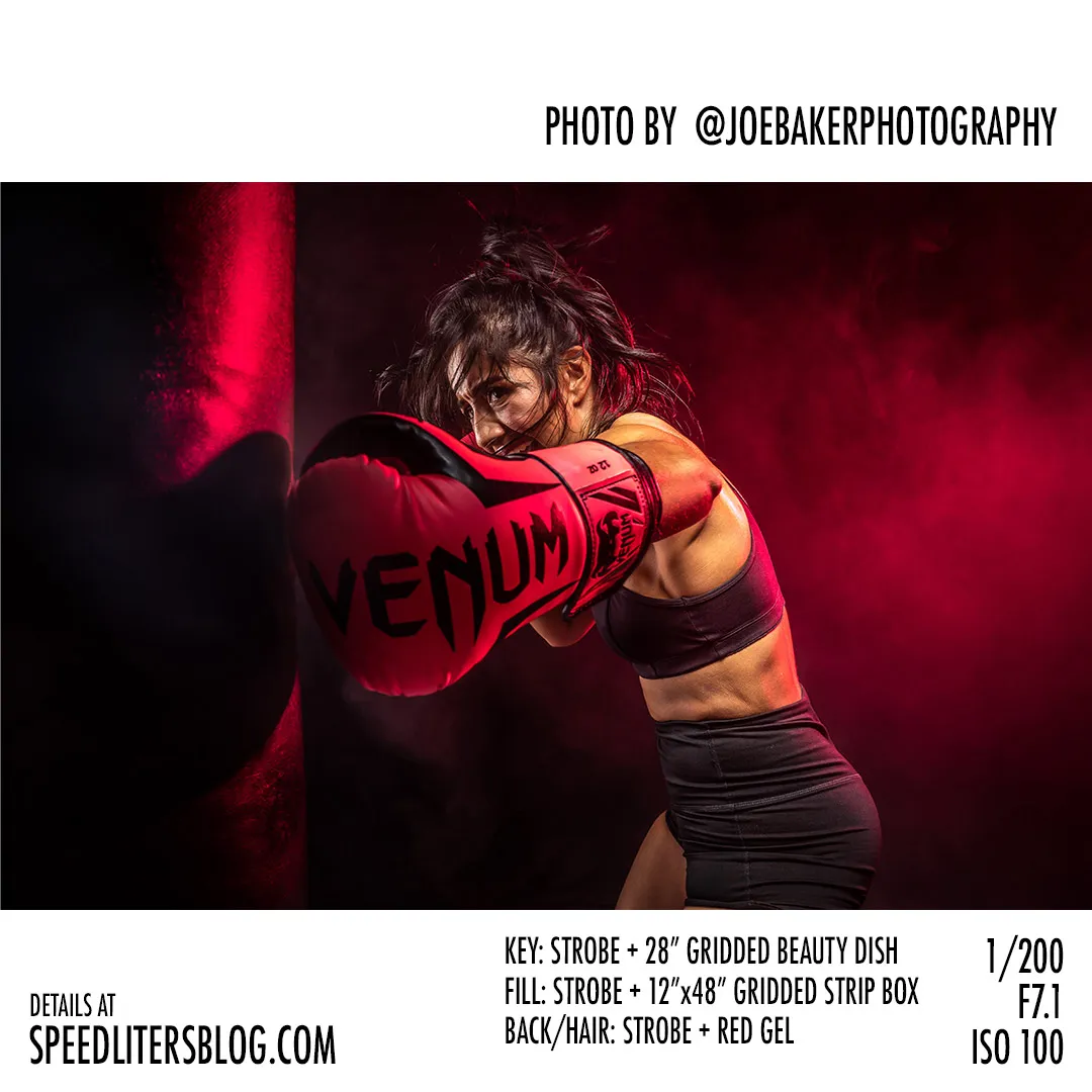Female boxer hitting a heavy bag under red light, by Joe Baker