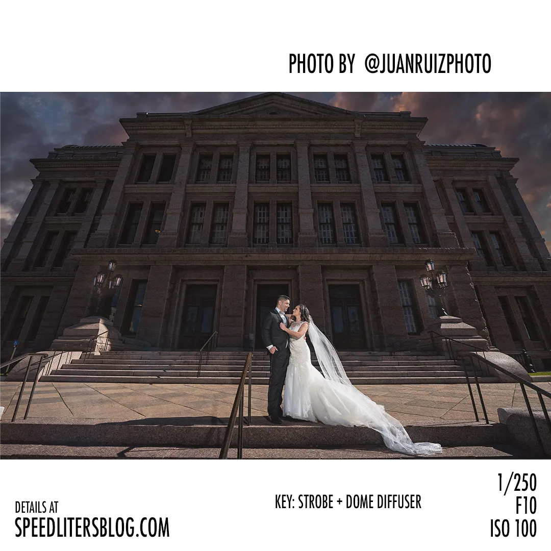 Bride and groom on the steps of a grand stone building under dramatic skies, by Juan Ruiz