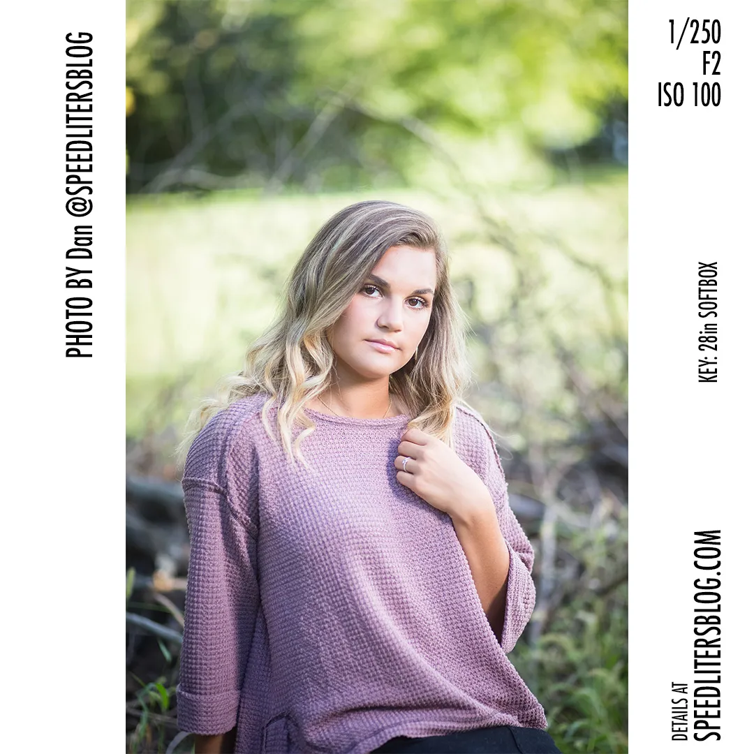 Senior girl in a mauve sweater, shallow depth of field in the woods