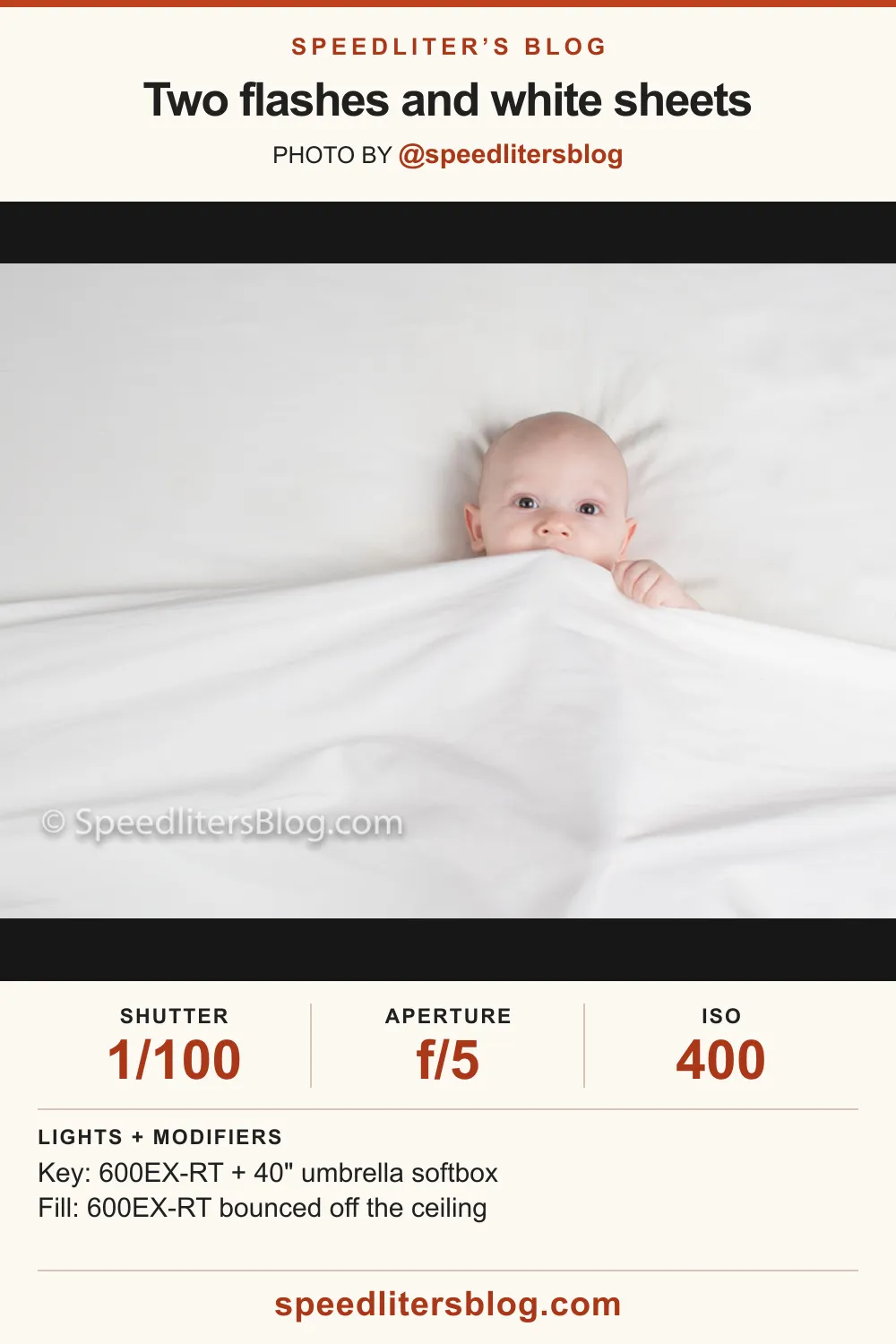 Baby peeking over a white sheet