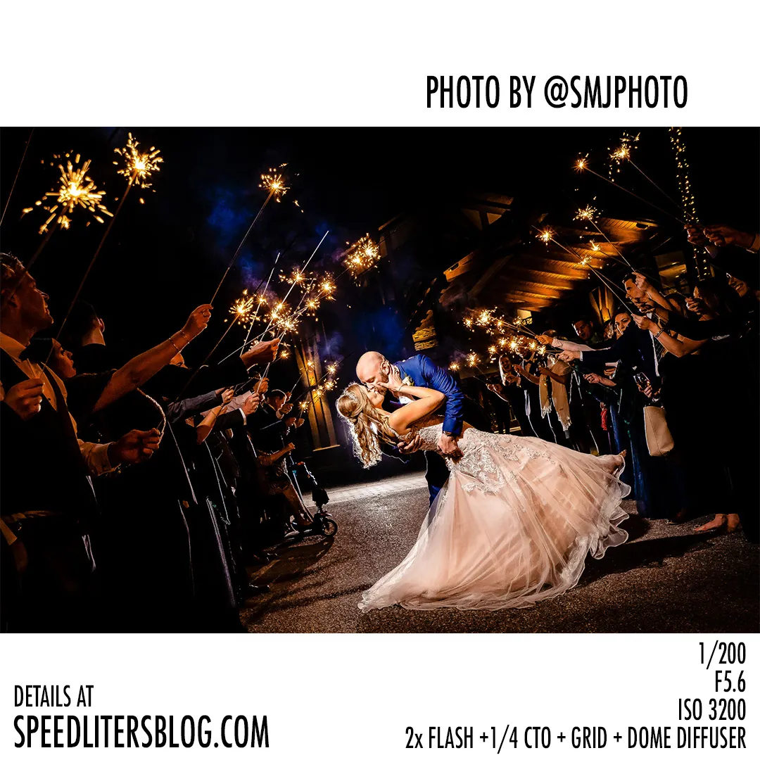 Groom dipping the bride through a sparkler exit at night, by SMJ Photography