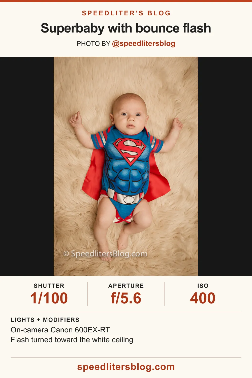 Baby in a Superman outfit and cape lying on a fur rug, lit by bounce flash