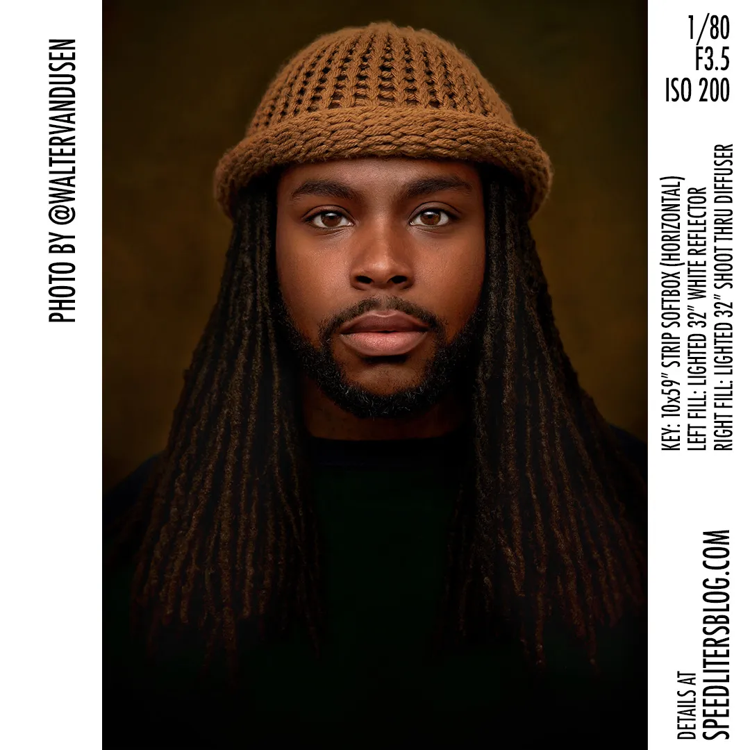 Headshot of a man with long locs in a knit cap, lit by a strip softbox, by Walter van Dusen