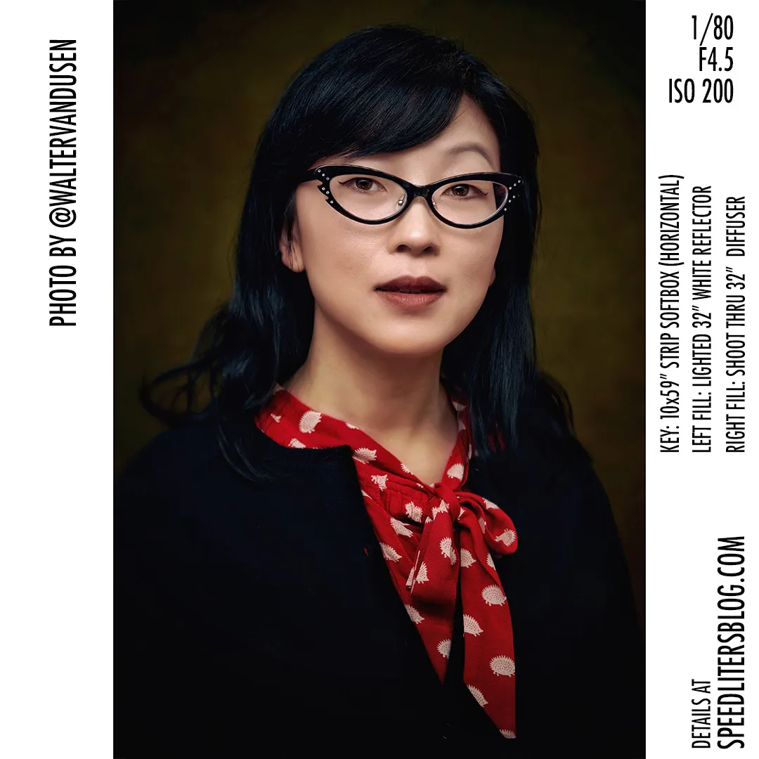 Headshot of a woman in cat-eye glasses and a red polka-dot scarf, by Walter van Dusen